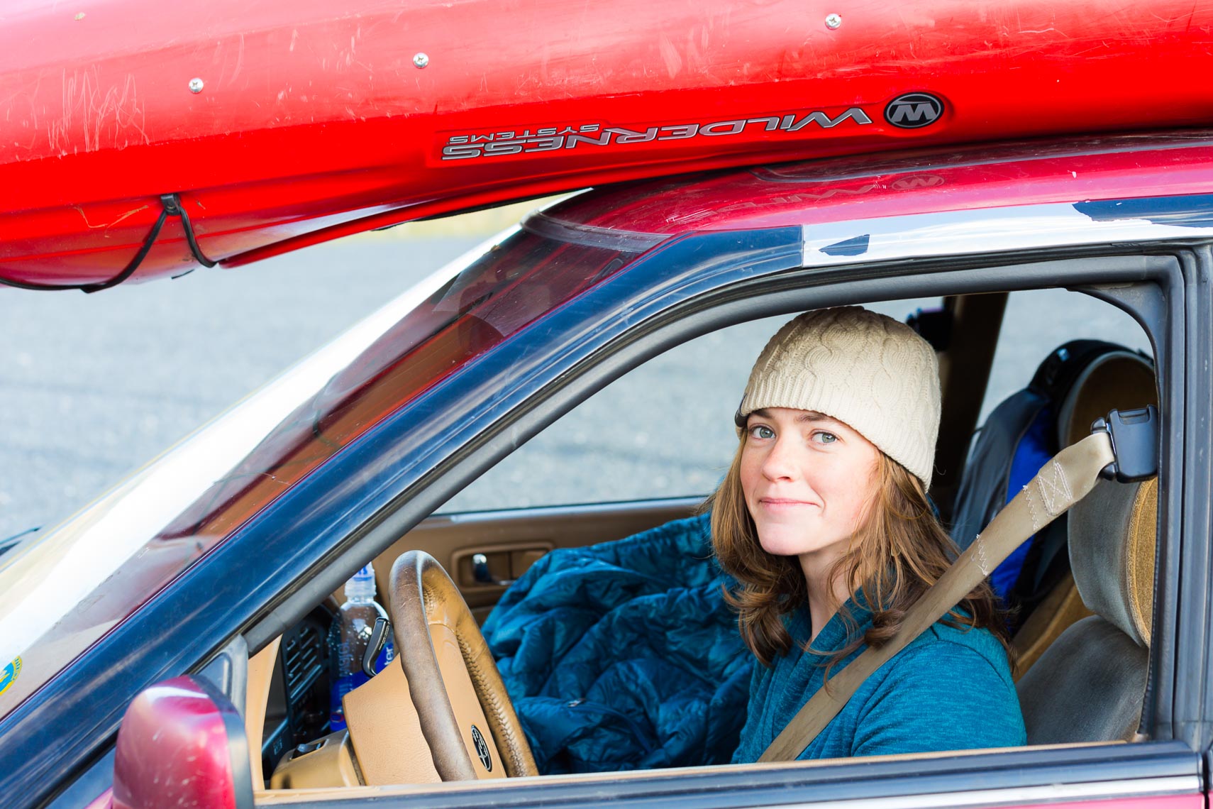 Environmental Portrait Woman With Kayak On Car | Michael DeYoung