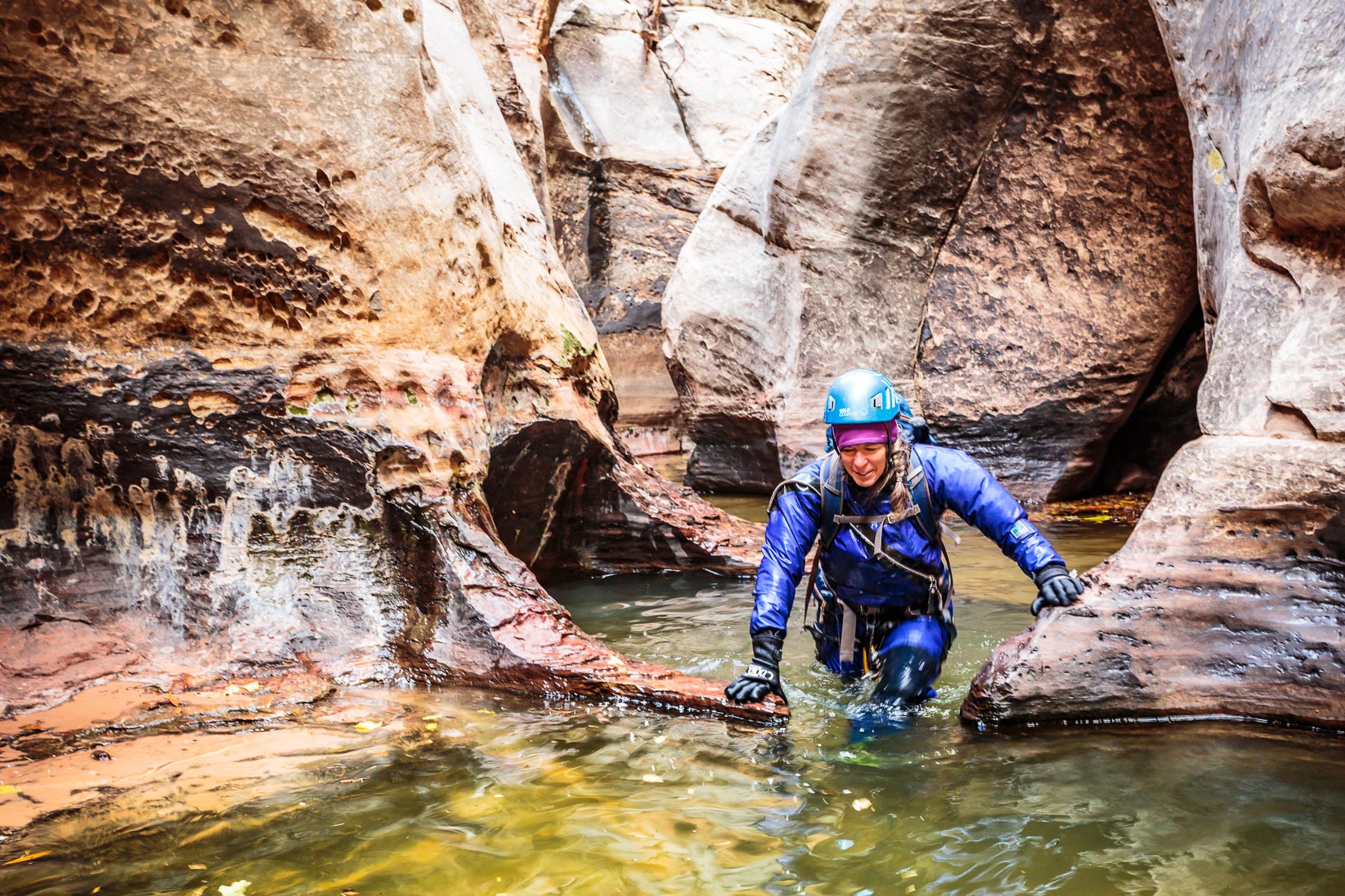 Hiker in Slot Canyon Pool Zion National Park | Michaael DeYoung