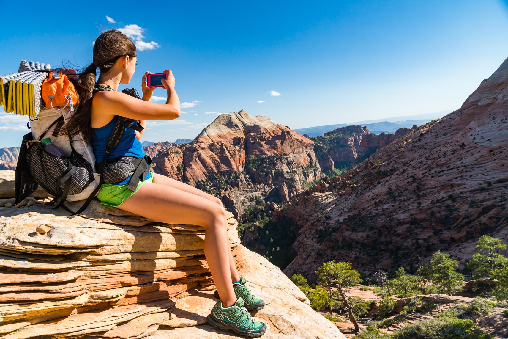 Female Backpacker Take Picture in Zion | Michael DeYoung